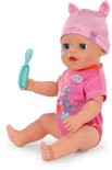 BABY born Emma pop zittend, in roze outfit, met muts met oortjes. Houdt een groen lepeltje vast.