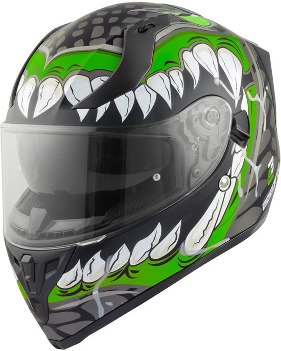 Casque intégral noir avec imprimé monstre vert, dents blanches et visière transparente.
