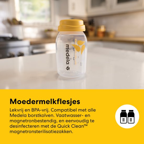 Een Medela moedermelkflesje met gele dop staat op een aanrecht.