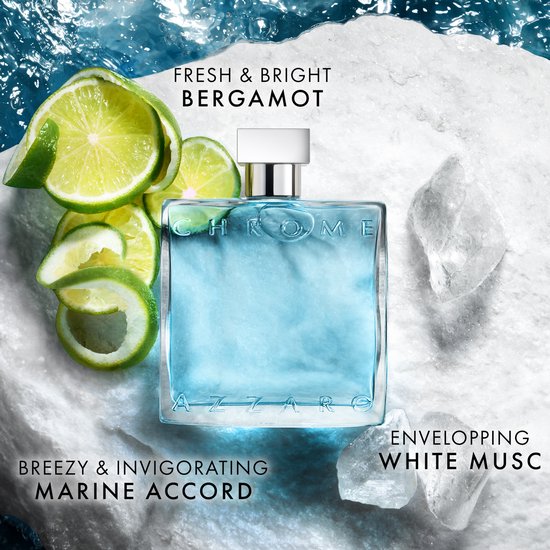 Azzaro Chrome Eau de Toilette met schijfjes limoen en ijs op witte stenen.
