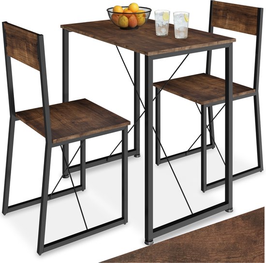 Eetset met tafel en twee stoelen, donkerbruin houtlook blad en zwart frame, met fruit en drankjes.