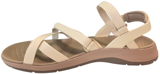 Zij-aanzicht van een beige Teva sandaal met taupe zool en bandjes.