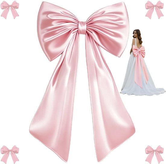 Nœud en satin rose pâle avec de longs rubans et une robe de mariée décorée.