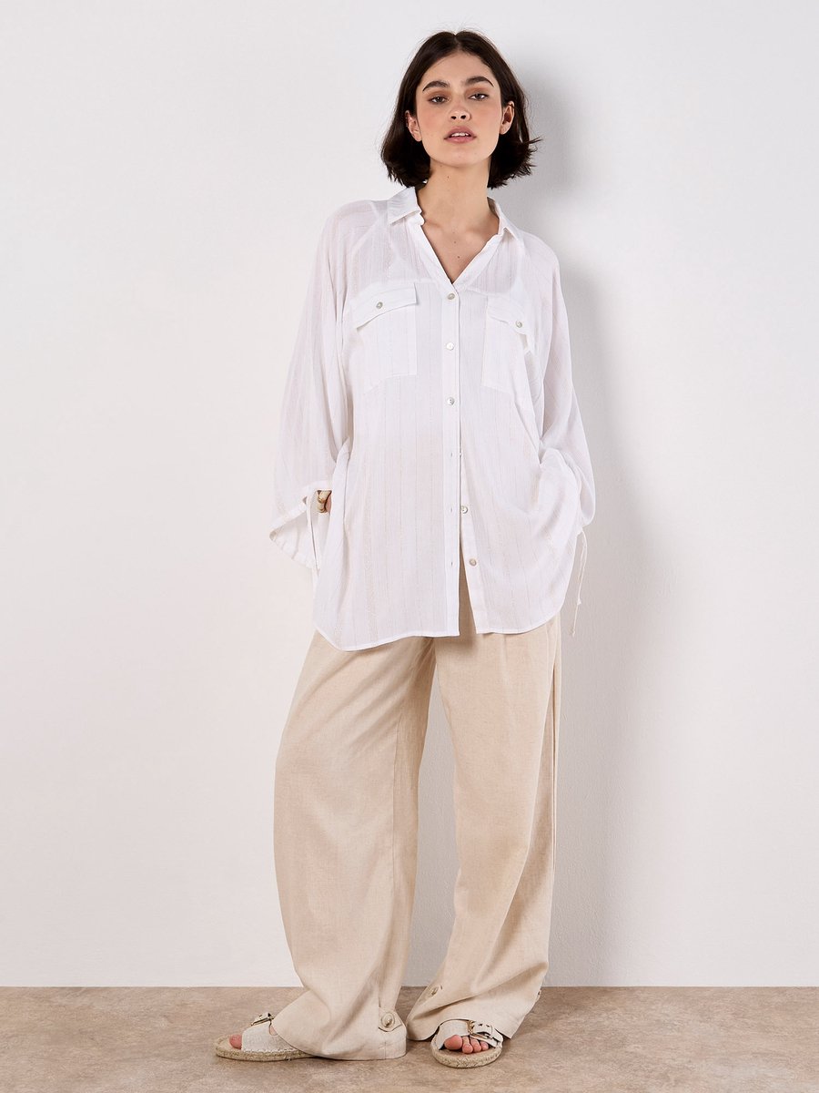 Oversized lang model glanzend shirt