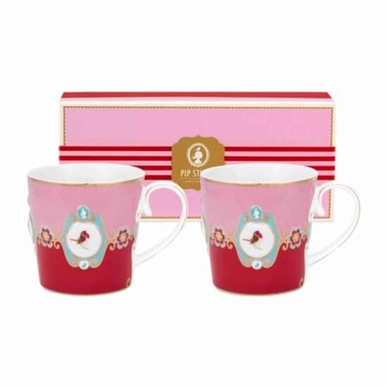 Deux tasses rose et rouge avec un médaillon d'oiseaux d'amour. Bord et anse dorés.