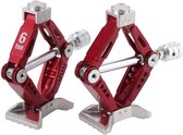 Twee rode schaarkrikken met een zilveren schroefmechanisme. Op de linker krik staat '6 ton'.