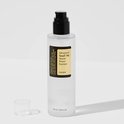 Fles COSRX Advanced Snail 96 Mucin Power Essence met losse dop naast de zwarte pomp.