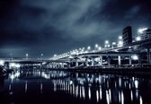 Fotobehang - Vlies Behang - Verlichte Stad aan het Water in de Nacht - 254 x 184 cm