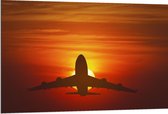 Dibond - Silhouet van Vliegtuig tegen Feloranje Zon in Roodkleurige Lucht - 120x80 cm Foto op Aluminium (Met Ophangsysteem)