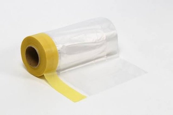 Een rol schilderstape met een stuk geel maskerende tape dat is uitgerold.