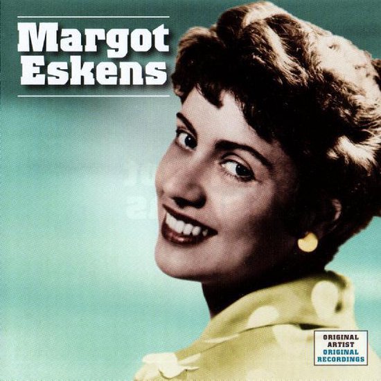 Margot Eskens met blonde krullen, lachend en met gele oorbellen. Tekst: Margot Eskens.