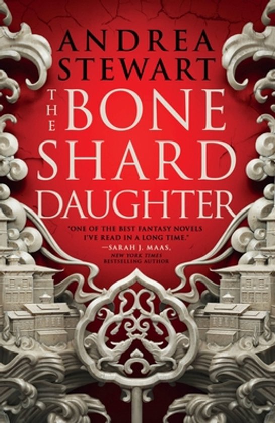 Boek 'The Bone Shard Daughter' van Andrea Stewart met een rode achtergrond en een sierlijke, grijze versiering aan de zijkanten en onderkant.