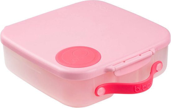Boîte à lunch b.box rose avec poignée et fermoir roses. La boîte à lunch a un compartiment rond rouge.