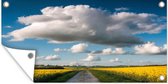 Schuttingposter Wolken boven een geel veld - 200x100 cm - Tuindoek