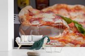 Behang - Fotobehang Pizza op een bord - Breedte 600 cm x hoogte 400 cm