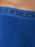 Detail van de donkerblauwe tailleband met 'MUCHACHOMALO' logo.