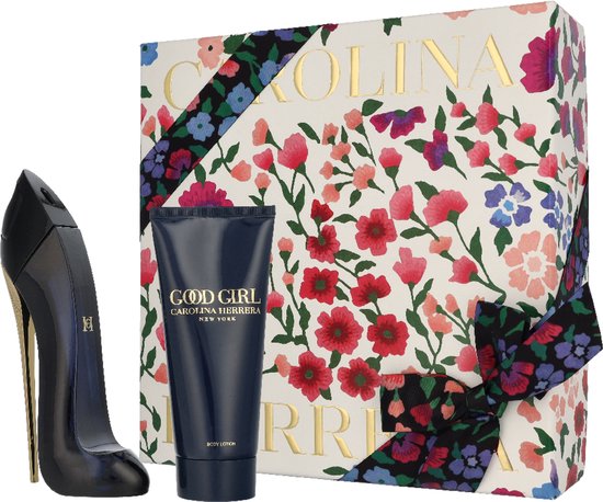 Geschenkdoos met bloemenprint, parfumflesje in de vorm van een zwarte pump met gouden hak en bodylotion.