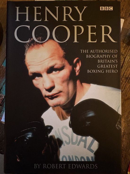 Couverture de livre avec le titre 'HENRY COOPER' et un portrait d'homme portant des gants de boxe.