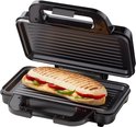 Open zwarte grill met een gegrilde panini met rode en groene paprika.