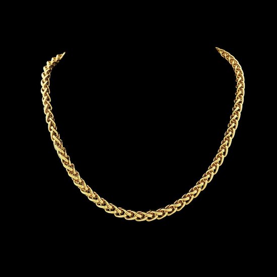 Collier en or de type queue de renard sur fond noir.
