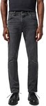 Man in een grijze spijkerbroek van Wrangler met een slim fit en knoopsluiting.
