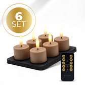 Set van 6 bruine LED waxinelichtjes op zwart oplaadstation met afstandsbediening.