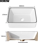 Afmetingen van een witte vierkante wastafel met zwarte rand: 483mm breed, 374mm lang, 135mm hoog.