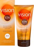 Doos en tube van Vision All Year Natural Tan zelfbruiner met oranje cirkel en tekst.