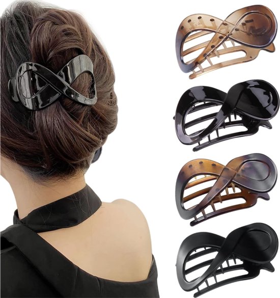 Vier platte haarclips in de vorm van een acht, in zwart en schildpadpatroon. Eén clip zit in donkerbruin haar, de rest los.
