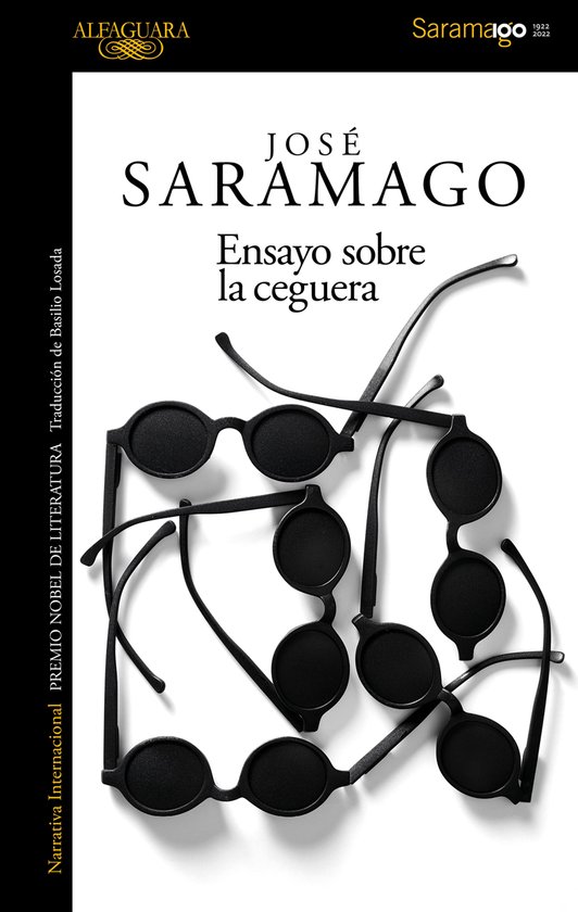 Boek met de titel 'Ensayo sobre la ceguera' door José Saramago, met een stapel zwarte brillen op de kaft.