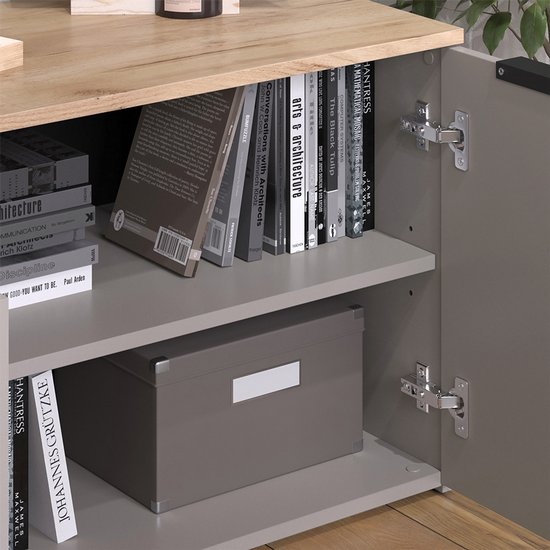 Detail van open grijze kast met houten blad, 2 planken vol met boeken en een opbergdoos.