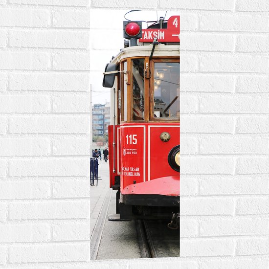 WallClassics - Muursticker - Rode Tram door de Stad - 30x90 cm Foto op Muursticker