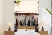 Behang - Fotobehang Een foto van tientallen surfplanken - Breedte 200 cm x hoogte 300 cm