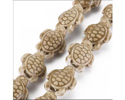 foto van Porseleinen kralen, schildpadden, 20x15x8mm, rijggat 1,8mm, camel. Per snoer van 18 kralen