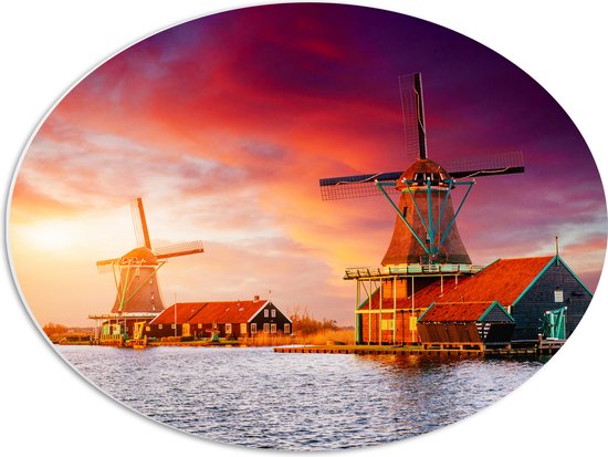PVC Schuimplaat Ovaal - Nederlandse Windmolens aan het Water onder Paars met Oranje Lucht - 56x42 cm Foto op Ovaal (Met Ophangsysteem)
