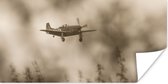 Poster Spitfire bij een donkere wolkenlucht - 80x40 cm