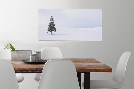 Tableau sur toile Un vide enneigé avec un sapin - 80x40 cm - Décoration murale