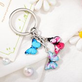 Bixorp - Porte-clés avec trois papillons différents rose, Blauw et coloré - Joli pendentif clé en acier inoxydable / acier inoxydable avec 3 papillons