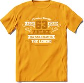63 Jaar Legend T-Shirt | Goud - Wit | Grappig Verjaardag en Feest Cadeau Shirt | Dames - Heren - Unisex | Tshirt Kleding Kado | - Geel - XL