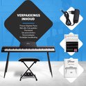 Inhoud: Finesse piano, kruk, pedalen, stickers, adapter en handleiding.