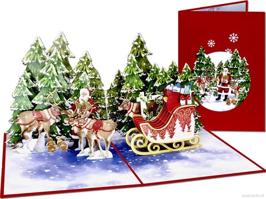 Kerstkaart met pop-up van Kerstman op slee, getrokken door rendieren, door een besneeuwd bos. Rode kaft met kerstboom en sneeuwvlokken.