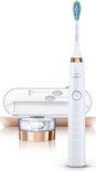 Witte Philips Sonicare tandenborstel met roségouden accenten, oplaadglas en bijpassend reisetui.