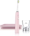 Roze Philips Sonicare tandenborstel met opzetborstel, oplaadglas en plat roze reisetui.