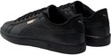 Zwarte Puma Smash sneakers met gouden Puma logo op de zijkant en hiel.
