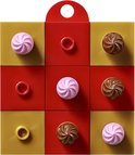 Een LEGO cadeaubox met negen vakjes, rood, goud en met roze en bruine LEGO toefjes.