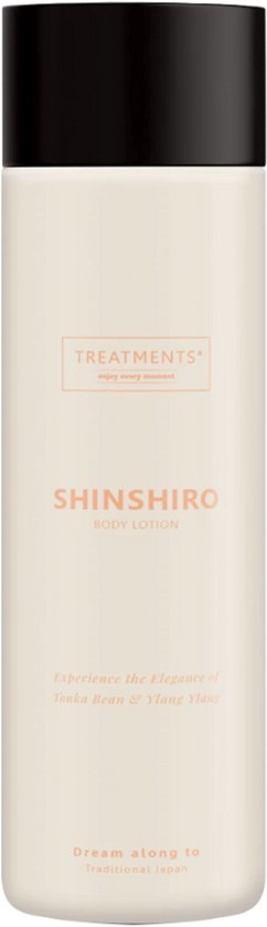 Crèmewitte fles TREATMENTS Shinshiro bodylotion met zwarte dop en oranje tekst over tonkaboon en ylang-ylang.