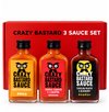Drie flessen Crazy Bastard saus in geschenkverpakking: Ghost Pepper & Mango, Trinidad Scorpion & Clementine, Carolina Reaper & Blueberry.
