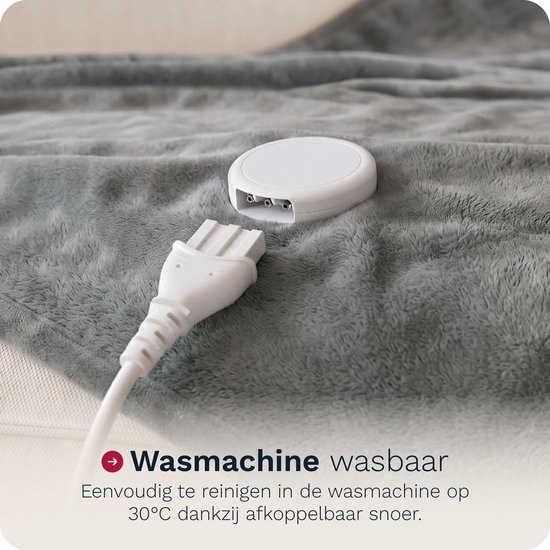 Afneembare, waterdichte connector van een grijze elektrische deken.