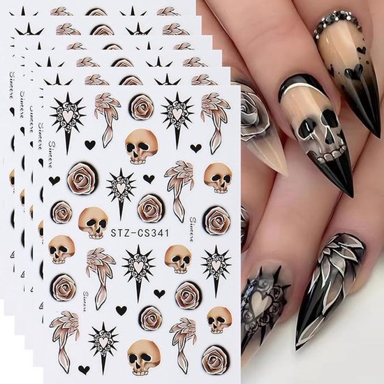 Nagelstickers met schedels, rozen en vleugels. Getoond op lange, puntige nagels met Halloween-ontwerpen.