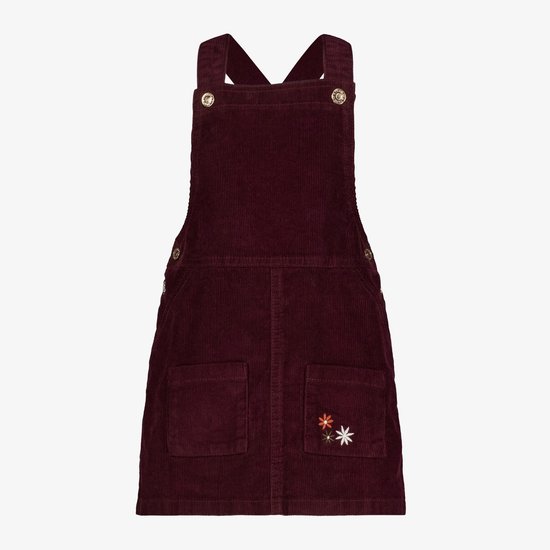 Bordeauxrode corduroy tuinbroekjurk met twee voorzakken, geborduurde bloemen en gouden knopen.